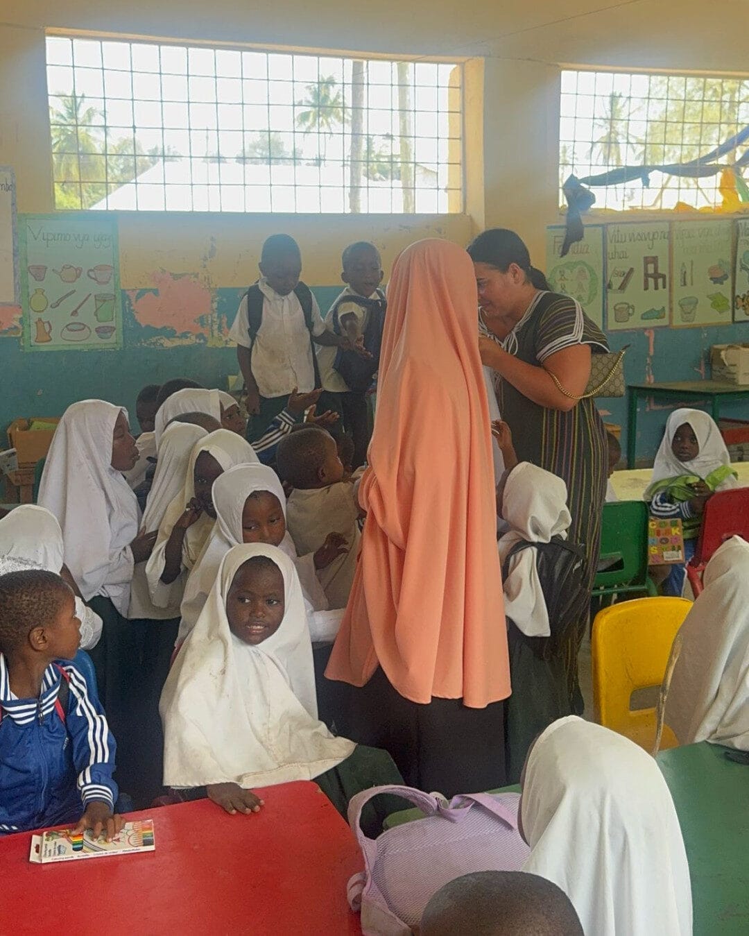 how to greet someone is swahili, on a school with the kids and teachers
